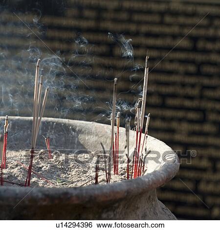 Stock Photograph - Incense sticks burning at Wat Phrathat Doi Suthep, Chiang Mai, Thailand. Fotosearch