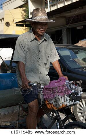 Stock Photography - Man pulling a rickshaw, Chiang Mai, Thailand. Fotosearch