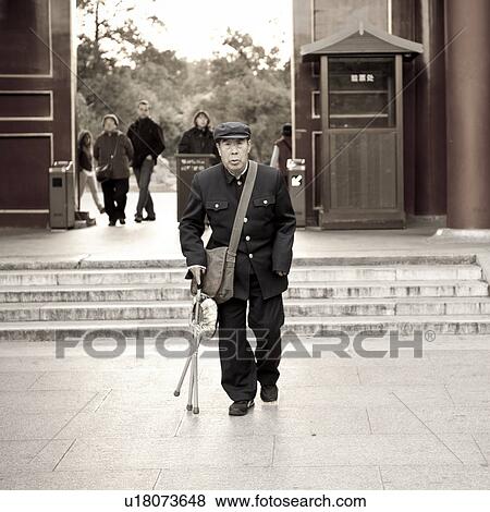 Man walking with the help of a cane, Forbidden City, Beijing, China View Large Photo Image Stock Photo - Man walking with the help of a cane, Forbidden City, Beijing, China. Fotosearch