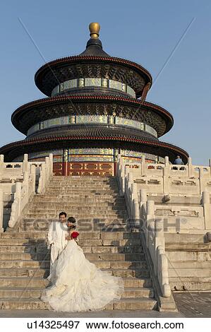 Newlywed couple on the steps of Hall Of Prayer For Good Harvests at the Temple Of Heaven, Beijing, China View Large Photo Image Stock Photo - Newlywed couple on the steps of Hall Of Prayer For Good Harvests at the Temple Of Heaven, Beijing, China. Fotosearch