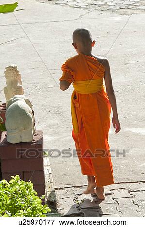 Stock Photo - Novice monk at Wat Sri Soda, Chiang Mai, Thailand. Fotosearch