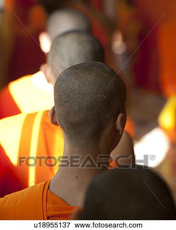 Stock Photo - Novice monks praying at Wat Sri Soda, Chiang Mai, Thailand. Fotosearch