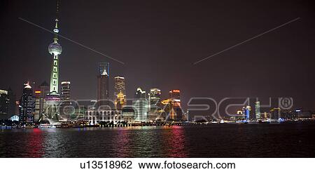 Stock Image - Oriental Pearl Tower and city skyline, Huangpu River, Pudong, Shanghai, China. Fotosearch