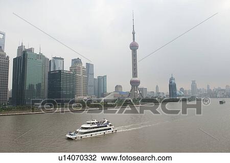 Stock Image - Oriental Pearl Tower and city skyline, Huangpu River, Pudong, Shanghai, China. Fotosearch