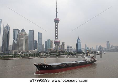 Stock Image - Oriental Pearl Tower and city skyline, Huangpu River, Pudong, Shanghai, China. Fotosearch