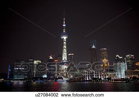 Stock Image - Oriental Pearl Tower and city skyline, Huangpu River, Pudong, Shanghai, China. Fotosearch