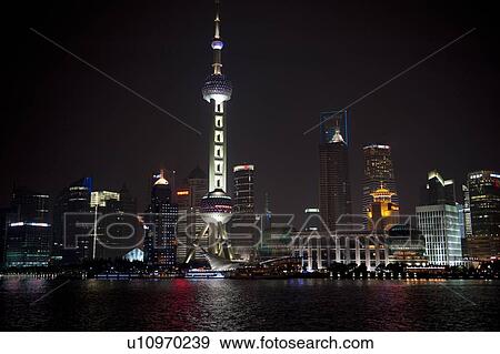 Stock Photo - Oriental Pearl Tower and city skyline, Huangpu River, Pudong, Shanghai, China. Fotosearch