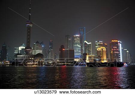 Stock Photo - Oriental Pearl Tower and city skyline, Huangpu River, Pudong, Shanghai, China. Fotosearch