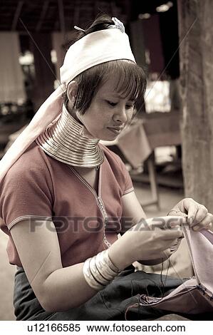 Stock Photography - Padaung woman sewing, Huay Pu Keng, Mae Hong Son Province, Thailand. Fotosearch