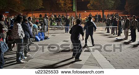 People playing feather kicker hacky sack, Back Lakes, Beijing, China View Large Photo Image Stock Image - People playing feather kicker hacky sack, Back Lakes, Beijing, China. Fotosearch