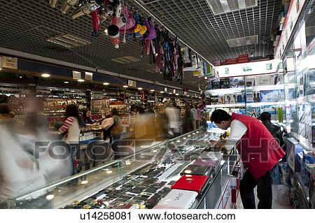 Stock Image - People shopping in Silk Street Market, Beijing, China. Fotosearch