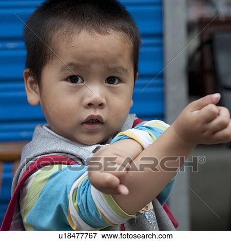 Stock Photo - Portrait of a boy, Shanghai, China. Fotosearch