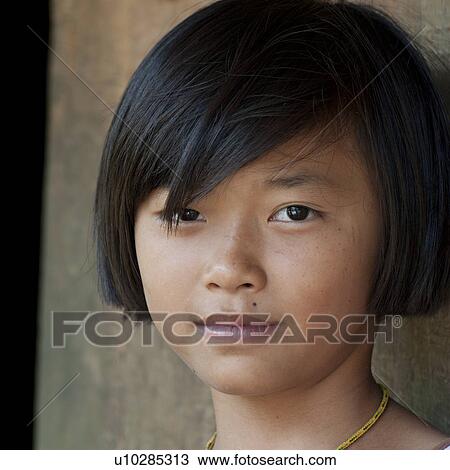 Stock Image - Portrait of a girl, Chiang Dao, Chiang Mai Province, Thailand. Fotosearch