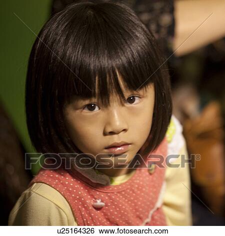 Stock Photograph - Portrait of a girl, Shanghai, China. Fotosearch