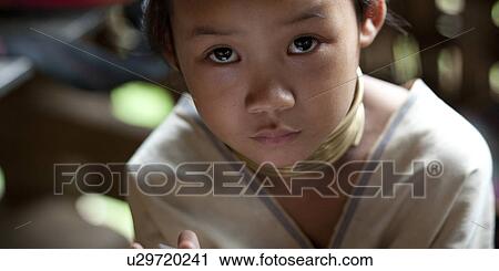Stock Image - Portrait of a Padaung girl, Huay Pu Keng, Mae Hong Son Province, Thailand. Fotosearch