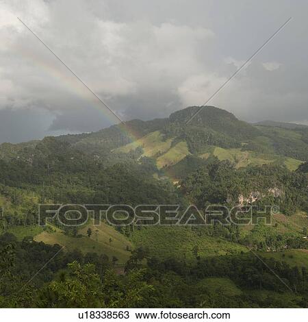Rainbow over a field, Thailand View Large Photo Image Stock Image - Rainbow over a field, Thailand. Fotosearch