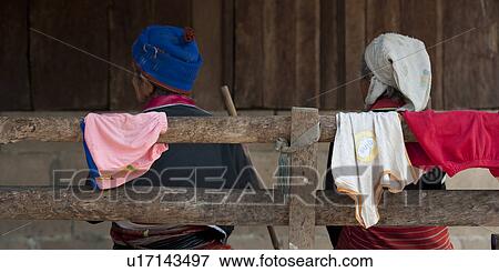 Rear view of a man and a woman sitting on a bench, Chiang Dao, Chiang Mai Province, Thailand View Large Photo Image Stock Photo - Rear view of a man and a woman sitting on a bench, Chiang Dao, Chiang Mai Province, Thailand. Fotosearch