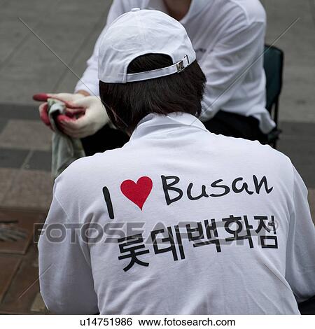 Stock Photograph - Rear view of a person wearing a t-shirt of 'I Love Busan' logo, Busan, Yeongnam, South Korea. Fotosearch
