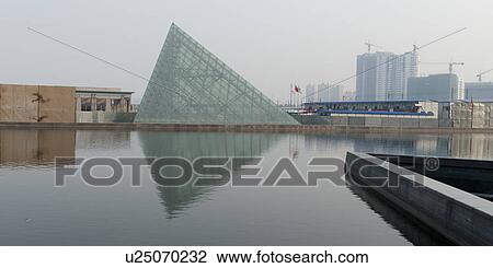 Reflection of a pyramid in water, TEDA Promenade, Binhai, Tianjin, China View Large Photo Image Stock Image - Reflection of a pyramid in water, TEDA Promenade, Binhai, Tianjin, China. Fotosearch