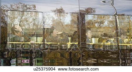 Reflection of passengers traveling by bus on glass, Beijing, China View Large Photo Image Picture - Reflection of passengers traveling by bus on glass, Beijing, China. Fotosearch