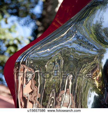 Stock Photograph - Reflection on a sculpture at the 798 Space, Dashanzi Art District, Dashanzi, Chaoyang District, Beijing, China. Fotosearch