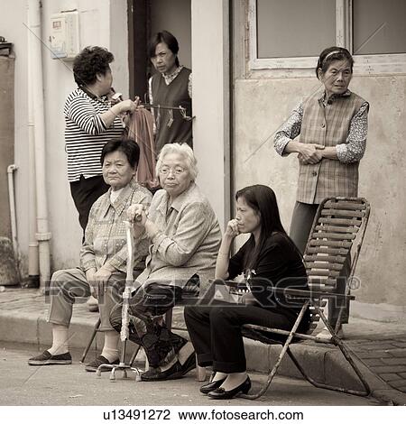 Senior women at a street, Shanghai, China View Large Photo Image Stock Image - Senior women at a street, Shanghai, China. Fotosearch