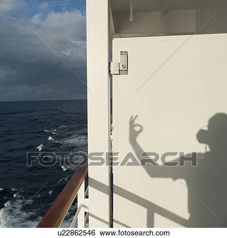 Shadow of a person gesturing on a cruise ship Silver Shadow, East China Sea View Large Photo Image Stock Photograph - Shadow of a person gesturing on a cruise ship Silver Shadow, East China Sea. Fotosearch