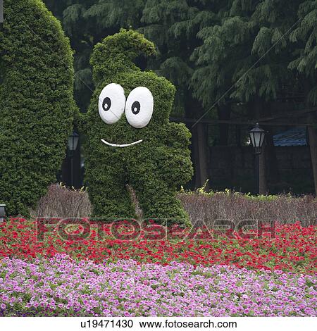 Stock Image - Shanghai World Expo 2010 Mascot in a garden, Shanghai, China. Fotosearch