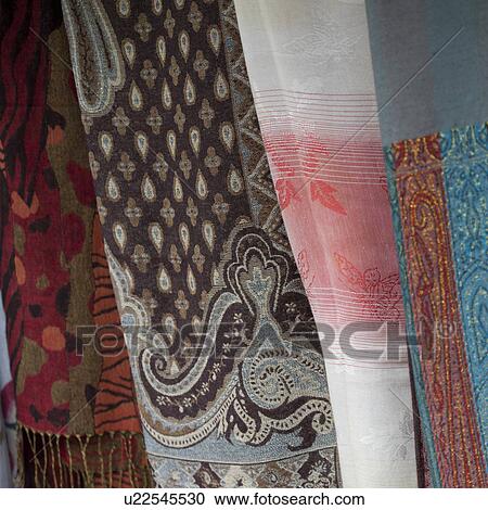 Stock Image - Shawls at a market stall, Huay Pu Keng, Mae Hong Son Province, Thailand. Fotosearch