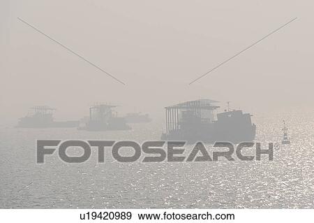 Silhouette of ships in the East China Sea, Tianjin, China View Large Photo Image Stock Photo - Silhouette of ships in the East China Sea, Tianjin, China. Fotosearch