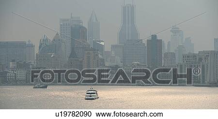 Stock Image - Skyscrapers at the waterfront, Huangpu River, Pudong, Shanghai, China. Fotosearch