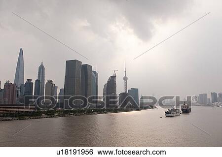 Stock Photograph - Skyscrapers at the waterfront, Huangpu River, Pudong, Shanghai, China. Fotosearch