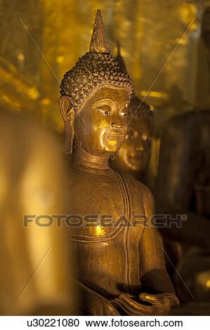 Stock Image - Statue of Buddha at Wat Phra Singh, Chiang Mai, Thailand. Fotosearch