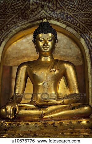Stock Photograph - Statue of Buddha at Wat Phra Singh, Chiang Mai, Thailand. Fotosearch