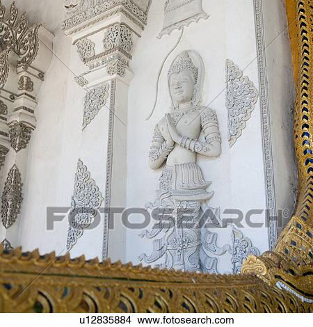 Statue the wall of Wat Phra Singh, Chiang Mai, Thailand View Large Photo Image Picture - Statue the wall of Wat Phra Singh, Chiang Mai, Thailand. Fotosearch