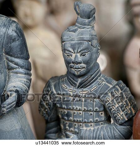 Statues at a market stall, Shanghai, China View Large Photo Image Stock Photography - Statues at a market stall, Shanghai, China. Fotosearch