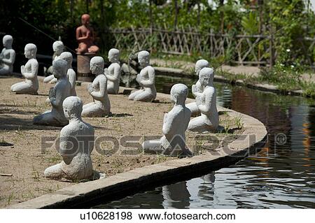 Statues of monks along a pond in Wat Horcome, Chiang Mai, Thailand View Large Photo Image Stock Photo - Statues of monks along a pond in Wat Horcome, Chiang Mai, Thailand. Fotosearch