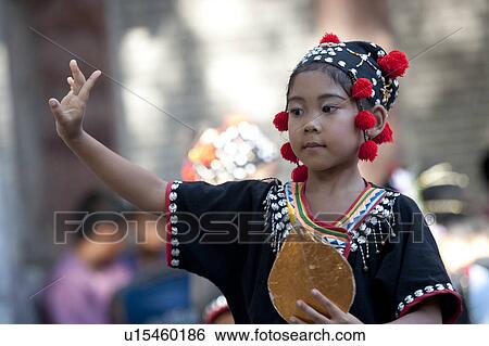 Stock Photograph - Thai girl dancing at Wat Phrathat Doi Suthep, Chiang Dao, Chiang Mai Province, Thailand. Fotosearch