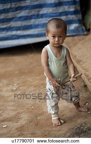Toddler playing with a stick, Thailand View Large Photo Image Stock Image - Toddler playing with a stick, Thailand. Fotosearch