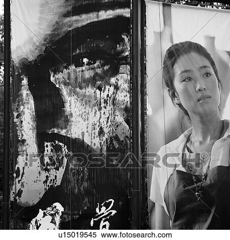 Stock Photography - Tourist admiring paintings in an art gallery, Shanghai, China. Fotosearch