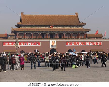 Stock Image - Tourists at a palace, Tiananmen Gate Of Heavenly Peace, Tiananmen Square, Forbidden City, Beijing, China. Fotosearch