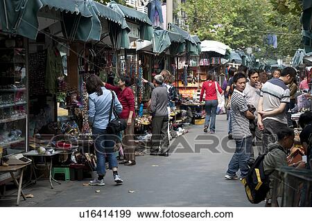 Stock Photo - Tourists at a street market, Shanghai, China. Fotosearch