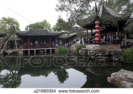 Picture - Tourists resort over a creek in Master of the Nets Garden, Suzhou, Jiangsu Province, China. Fotosearch