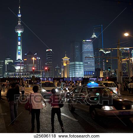 Tourists with Oriental Pearl Tower in the background, The Bund, Shanghai, China View Large Photo Image Stock Photo - Tourists with Oriental Pearl Tower in the background, The Bund, Shanghai, China. Fotosearch