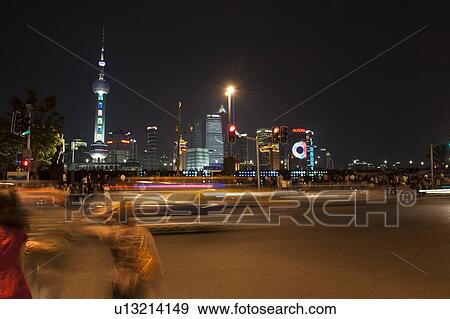 Tourists with the Oriental Pearl Tower in the background, The Bund, Pudong, Shanghai, China View Large Photo Image Stock Photo - Tourists with the Oriental Pearl Tower in the background, The Bund, Pudong, Shanghai, China. Fotosearch