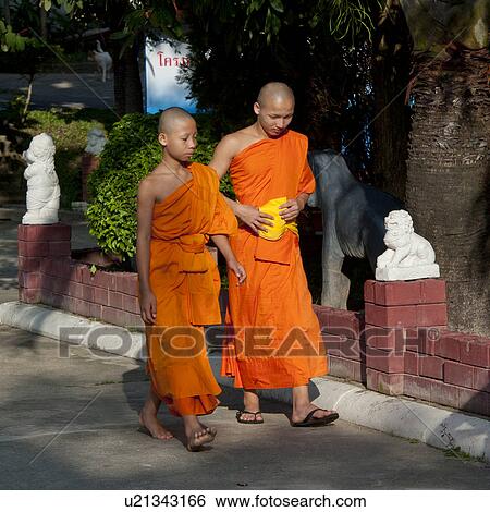 Two novice monks at Wat Srisoda, Chiang Mai, Thailand View Large Photo Image Stock Photograph - Two novice monks at Wat Srisoda, Chiang Mai, Thailand. Fotosearch
