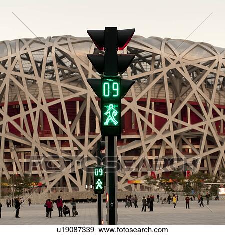 Walk signal in front of Beijing National Stadium, Olympic Green, Beijing, China View Large Photo Image Stock Photo - Walk signal in front of Beijing National Stadium, Olympic Green, Beijing, China. Fotosearch