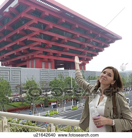 Woman pointing at China pavilion in Shanghai World Expo, Shanghai, China View Large Photo Image Stock Image - Woman pointing at China pavilion in Shanghai World Expo, Shanghai, China. Fotosearch