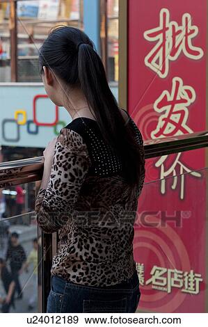Woman standing at balcony, Binhai, Tianjin, China View Large Photo Image Stock Photo - Woman standing at balcony, Binhai, Tianjin, China. Fotosearch