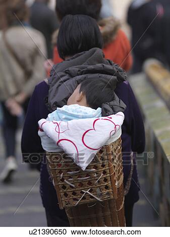 Women carrying her baby in a Baby Carrier, Forbidden City, Beijing, China View Large Photo Image Stock Image - Women carrying her baby in a Baby Carrier, Forbidden City, Beijing, China. Fotosearch